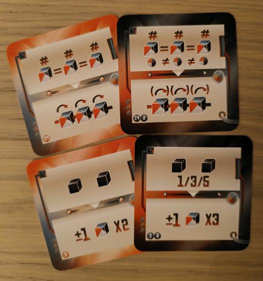 Cards and their higher difficulty versions. Top row: for the basic card, the 3 dice must show the same number; for the higher difficulty card, the dice must also be different colors.
