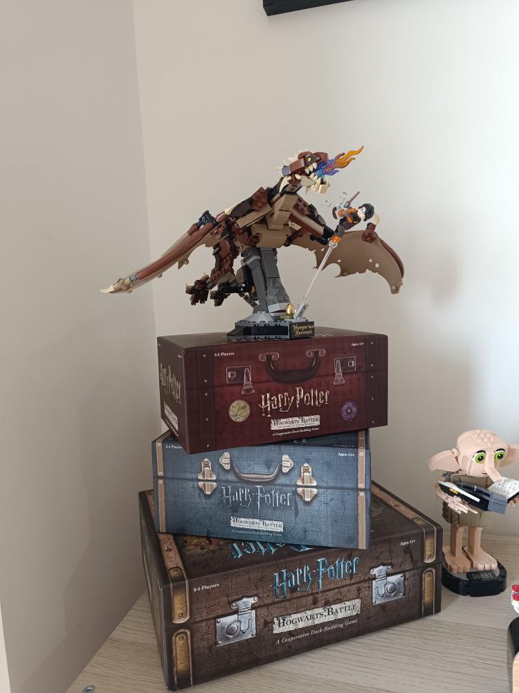Base game and both expansions stacked, suitcase-style boxes