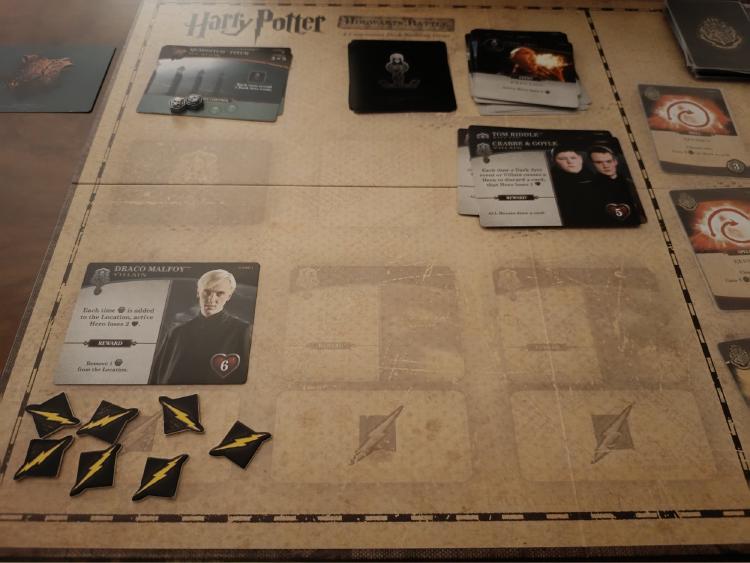 Draco Malfoy villain card with attack tokens assigned