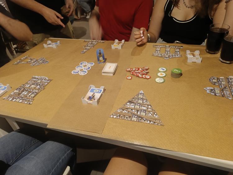 7 Wonders: Architects pyramid and wonder pieces being built on the table during a six-player game