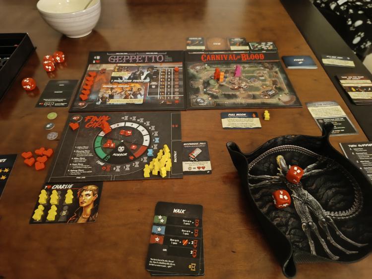 Final Girl board set up with the Geppetto killer board, Carnival of Blood location board and horror dice