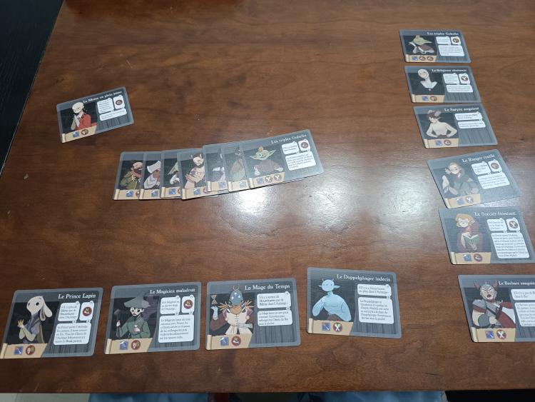 Ugly Gryphon Inn client cards spread out on the table showing the inn's colourful cast of characters