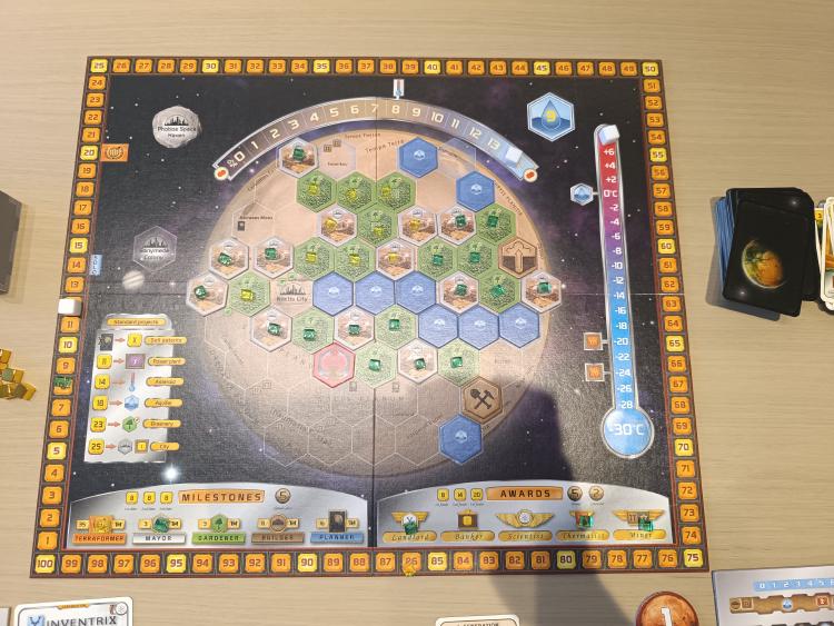 Terraforming Mars board mid-game showing the Mars hex grid, temperature and oxygen tracks, and milestones