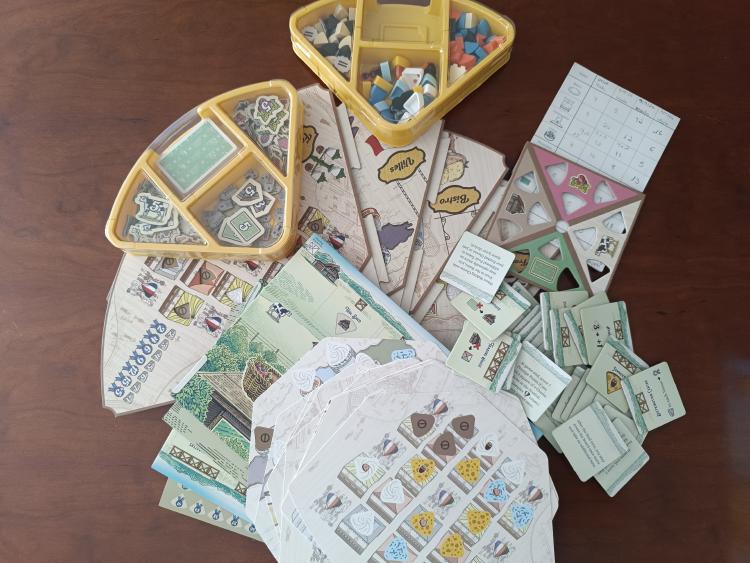 Fromage components spread out including order cards, structure tiles, board quadrants, scoring cards, and resource trays filled with tokens