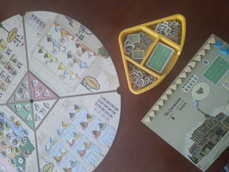 The Corporation's level 4 difficulty board next to the resource tray and game board, set up for a solo playthrough