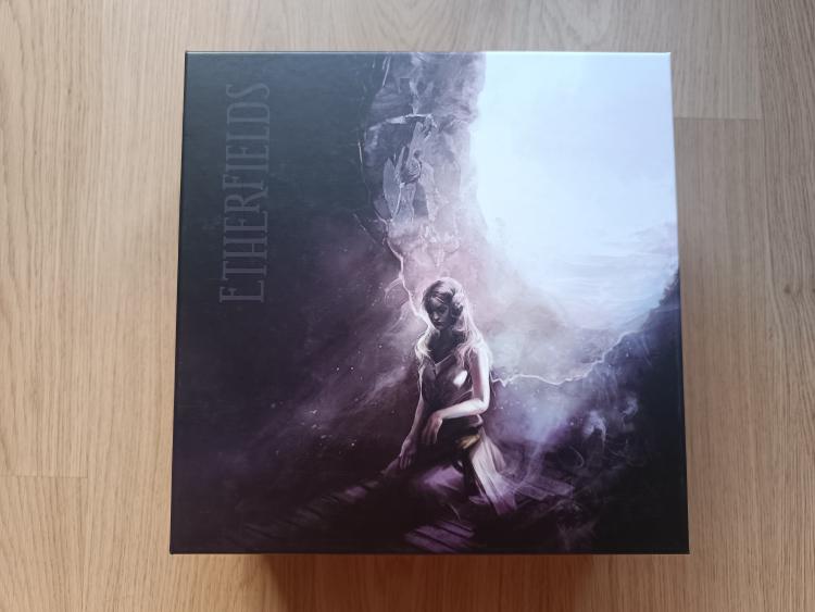 Etherfields box cover showing a lady between darkness and light