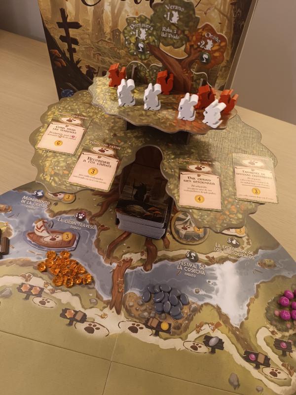 The Everdell 3D tree standing on the board with critter workers