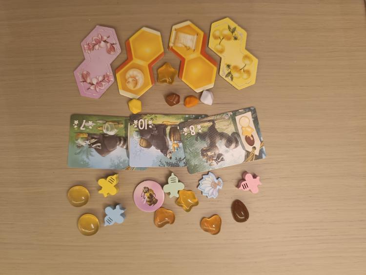 Honey Buzz hexagonal tiles, bee meeples and squishy honey tokens