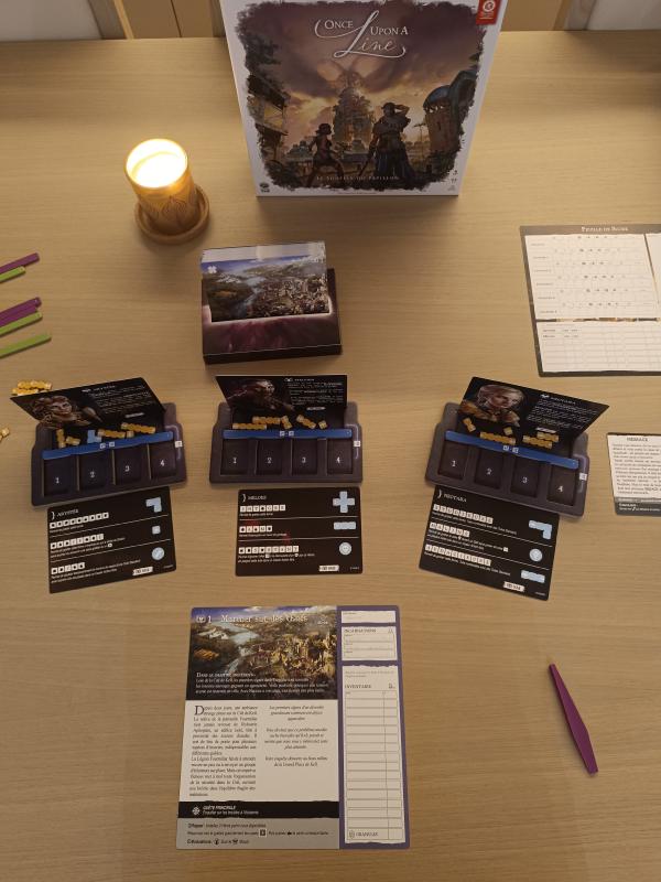 Once Upon a Line French edition set up for Chapter 1, with three hero cards, line tokens, the score sheet, the chapter card and a lit candle