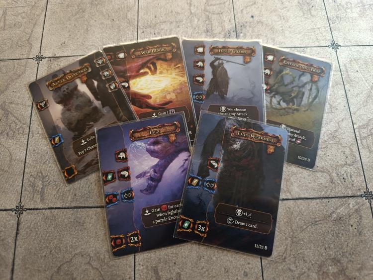 Six Tainted Grail combat and diplomacy cards fanned out, including War Magic, Hex and Find Weakness