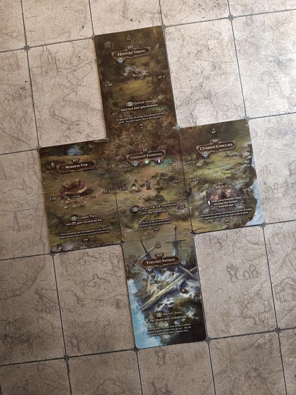 Five Tainted Grail location cards laid out in a cross, forming a continuous landscape
