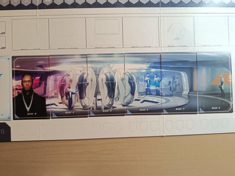 The T.I.M.E Stories agency base panorama, six cards forming one scene of pods under blue light