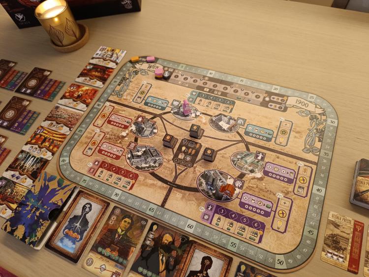 The Unconscious Mind main board showing Vienna in 1900, lit by a candle